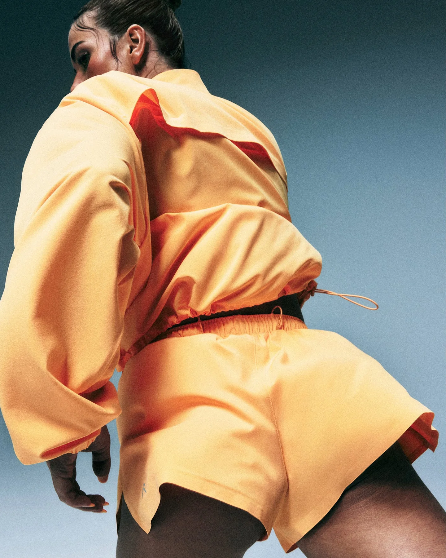 AirMove™ Lined Shorts 2" with Pocket and Reflective Logo | Powdered Orange - Image 2