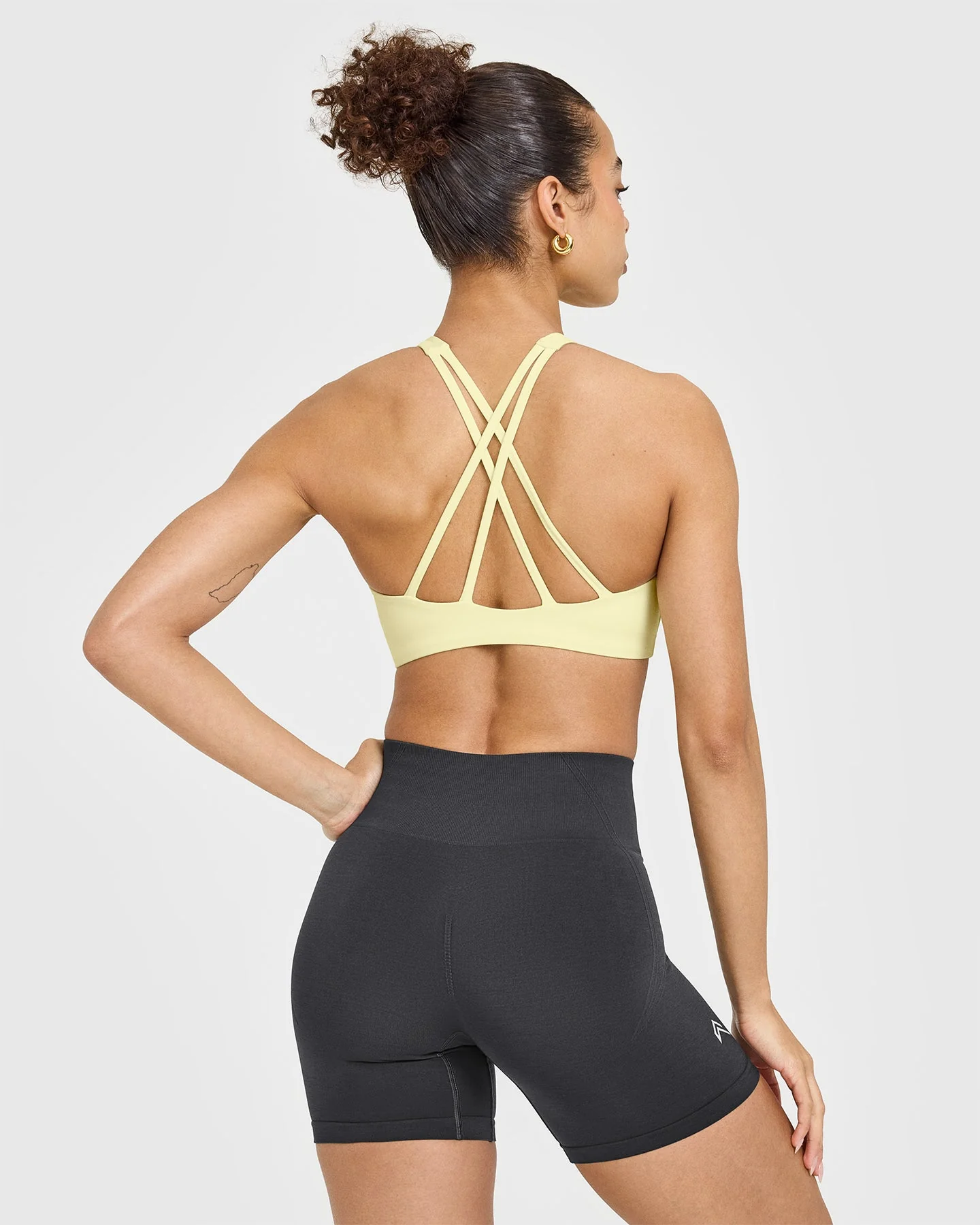 EasyLift™ High Neck Sports Bra with White Logo | Pastel Yellow - Image 2