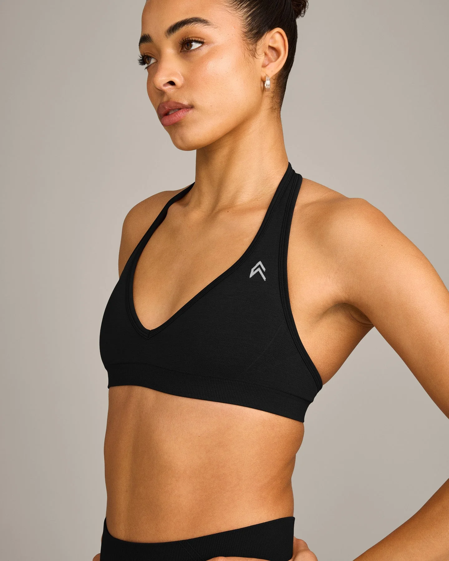 EffortlessLift™ Seamless Halter Neck Sports Bra with Grey Logo | Black - Image 2