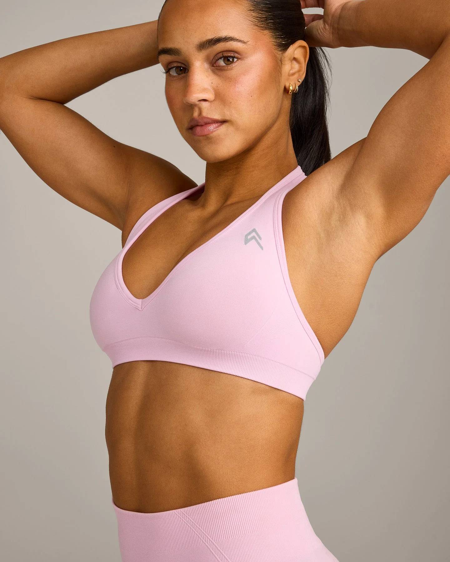 EffortlessLift™ Seamless Halter Neck Sports Bra with Grey Logo | Chalk Pink - Image 5