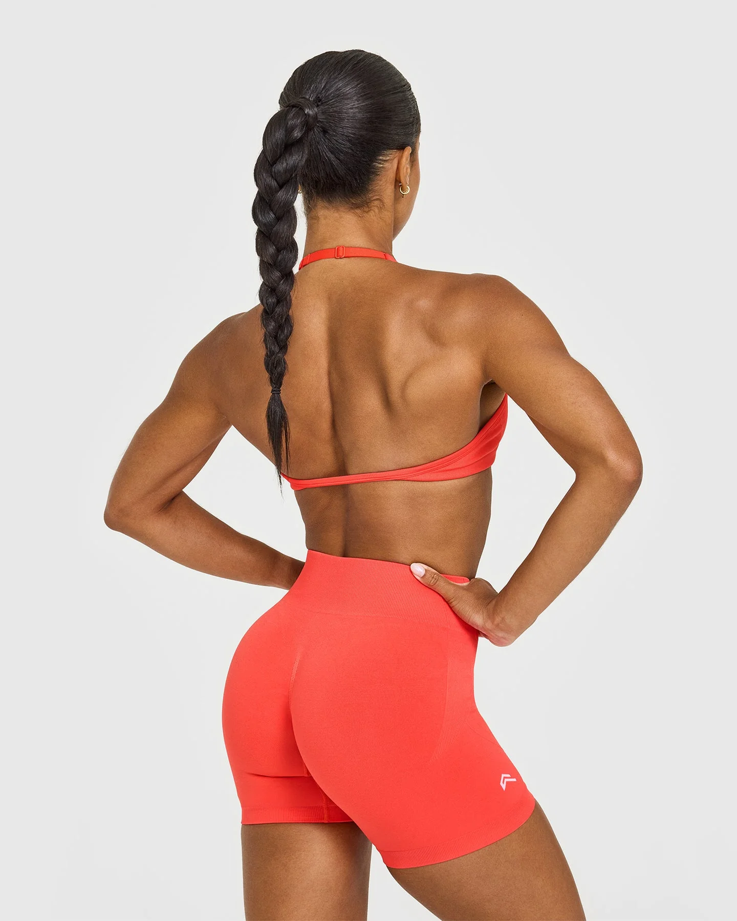 EnhanceLift™ Seamless Minimal Halter Neck Bralette with White Logo | Charged Coral - Image 5