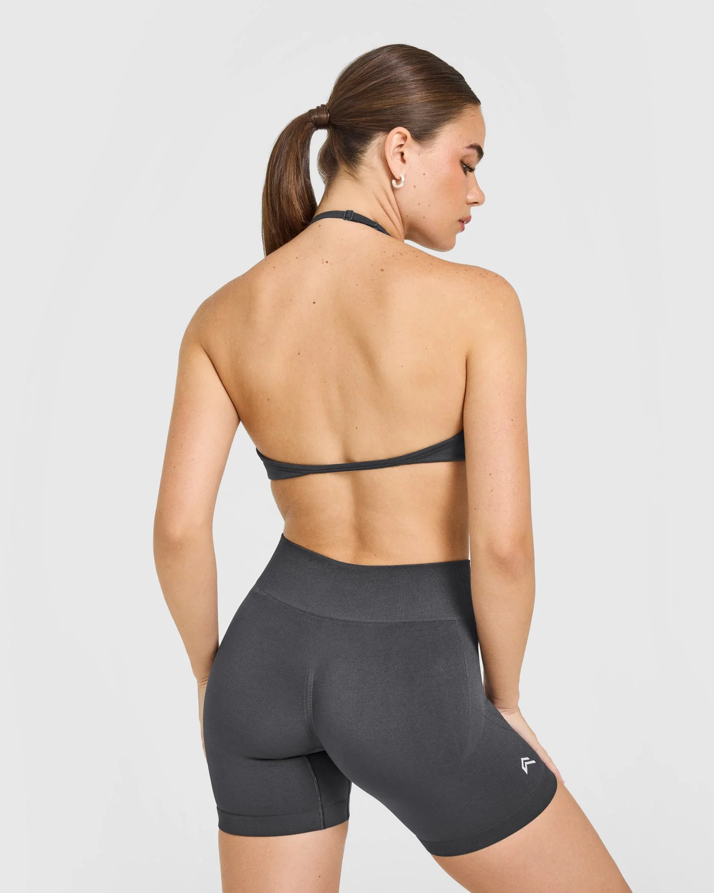 EnhanceLift™ Seamless Minimal Halter Neck Bralette with White Logo | Coal - Image 2
