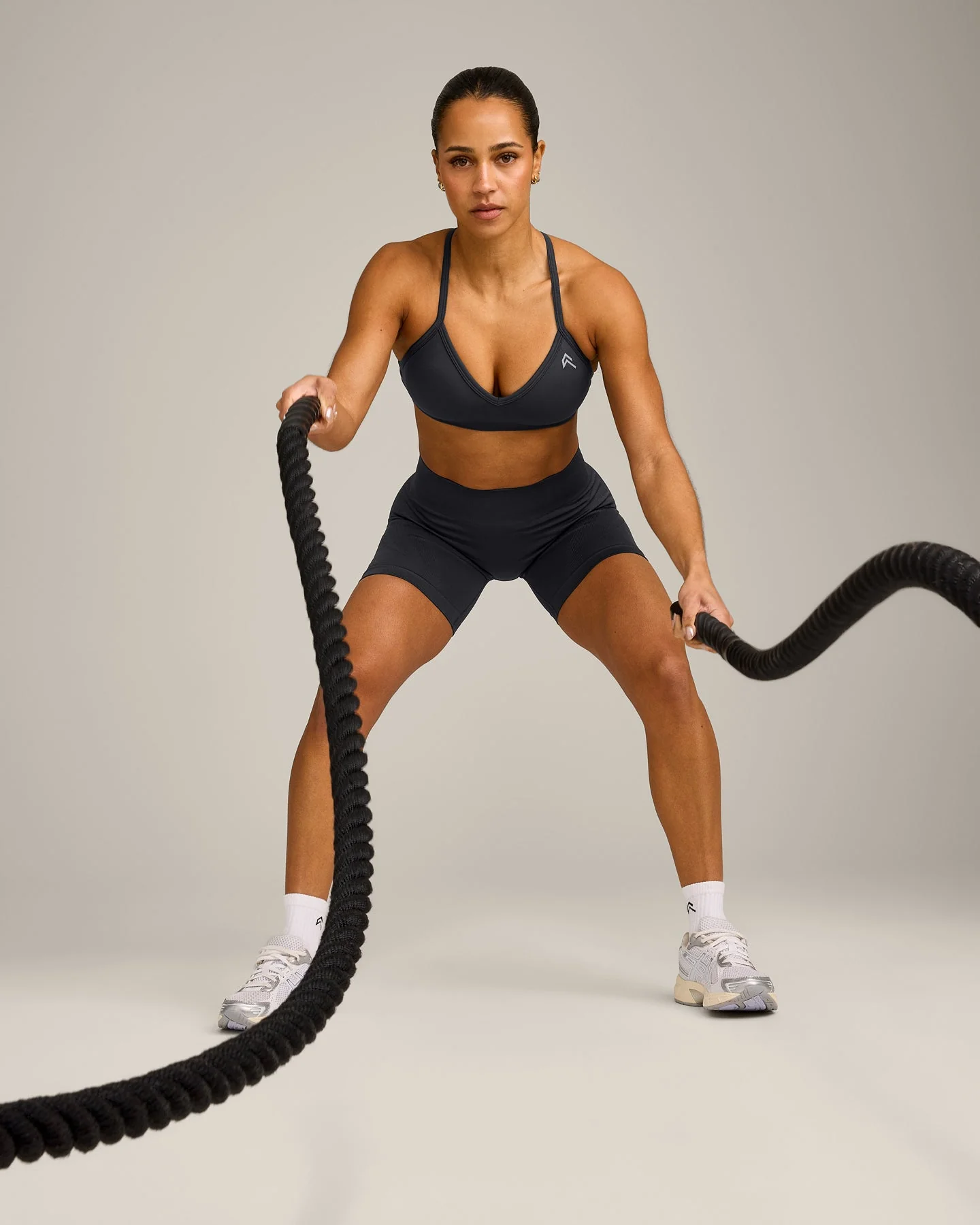 EnhanceLift™ Seamless Strappy Sports Bra with Grey Logo | Coal - Image 3