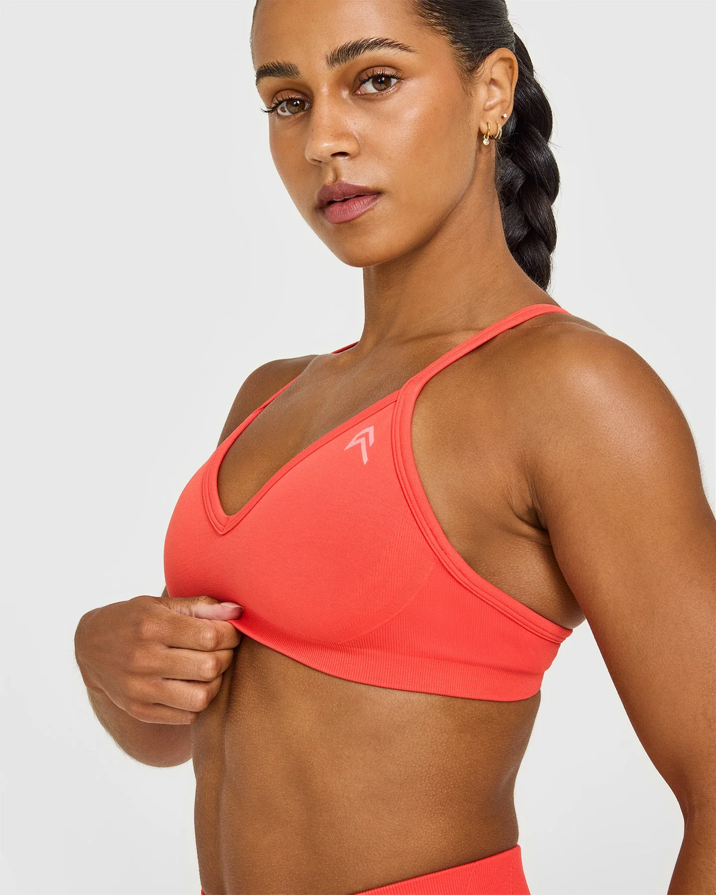 EnhanceLift™ Seamless Strappy Sports Bra with White Logo | Charged Coral - Image 5