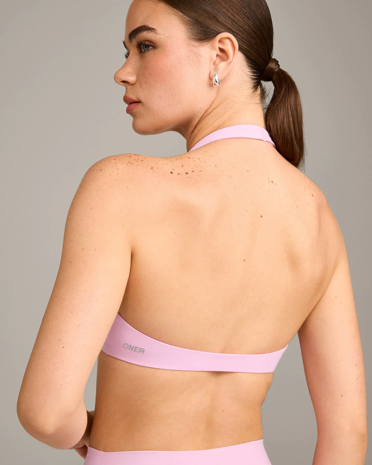 SoftMotion™ Minimal Halter Neck Bralette with Grey Logo | Chalk Pink - Image 4