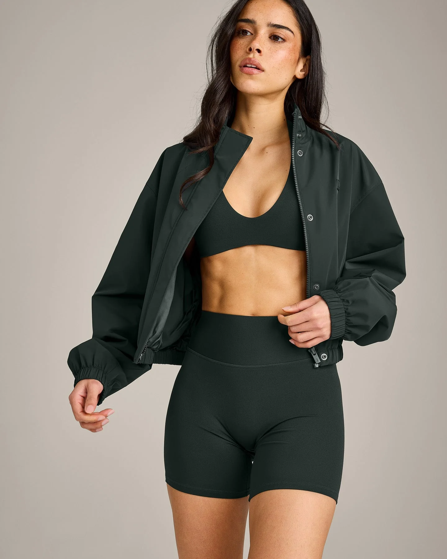 SoftMotion™ Minimal Halter Neck Bralette with Grey Logo | Emerald Noir - Image 4