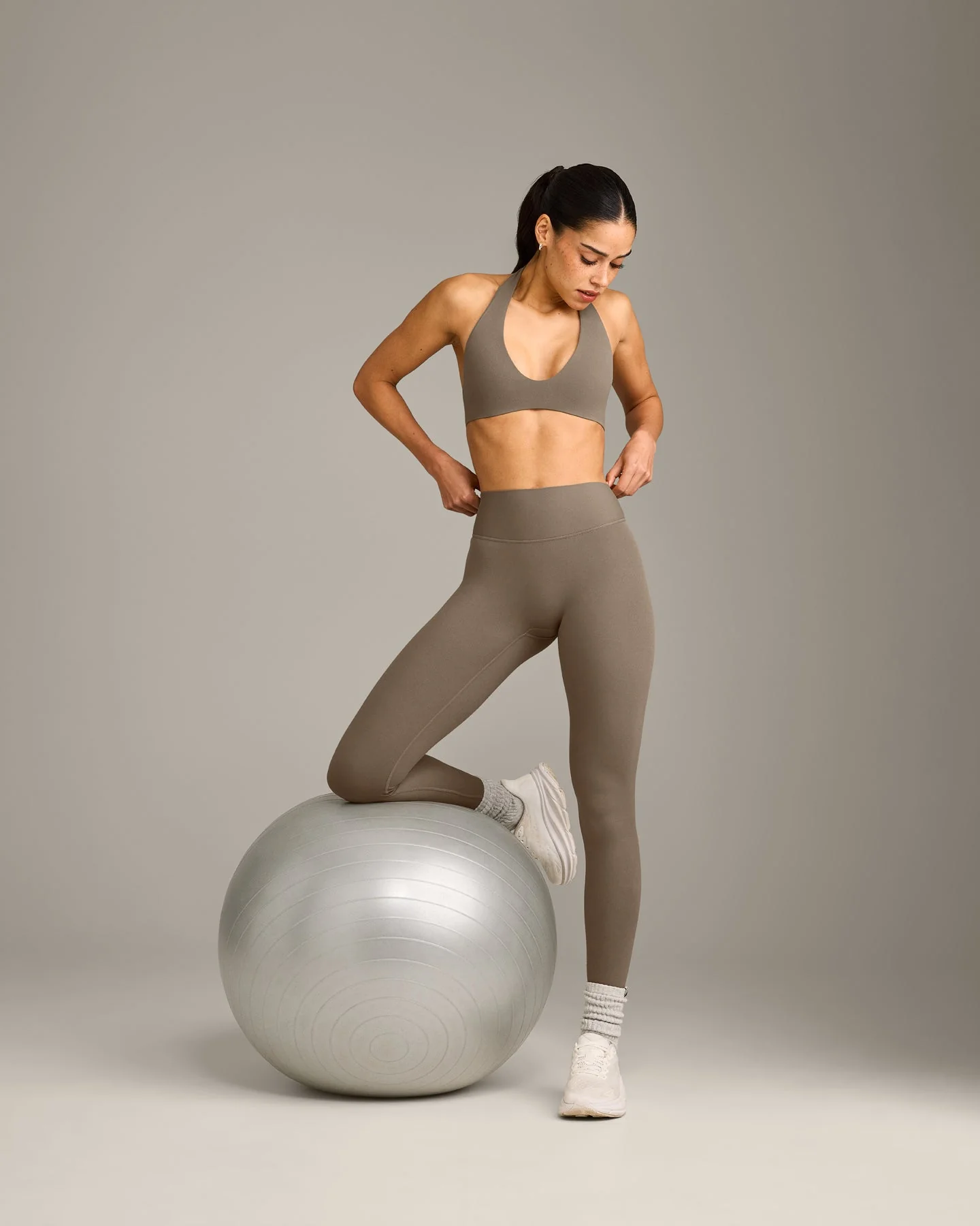 SoftMotion™ Minimal Halter Neck Bralette with Grey Logo | Moss Brown - Image 3