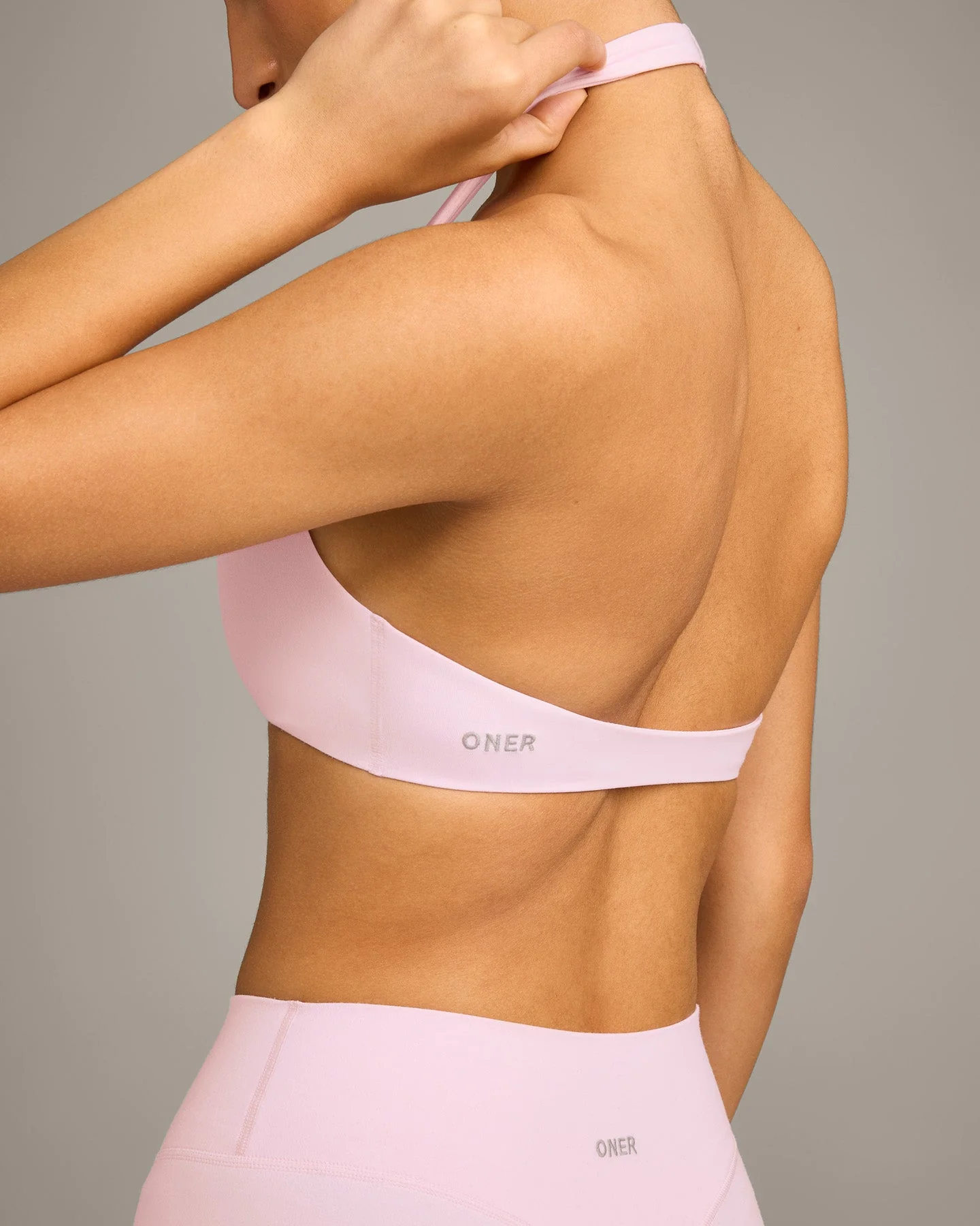 SoftMotion™ Minimal Halter Neck Bralette with Grey Logo | Soft Girl Pink - Image 5