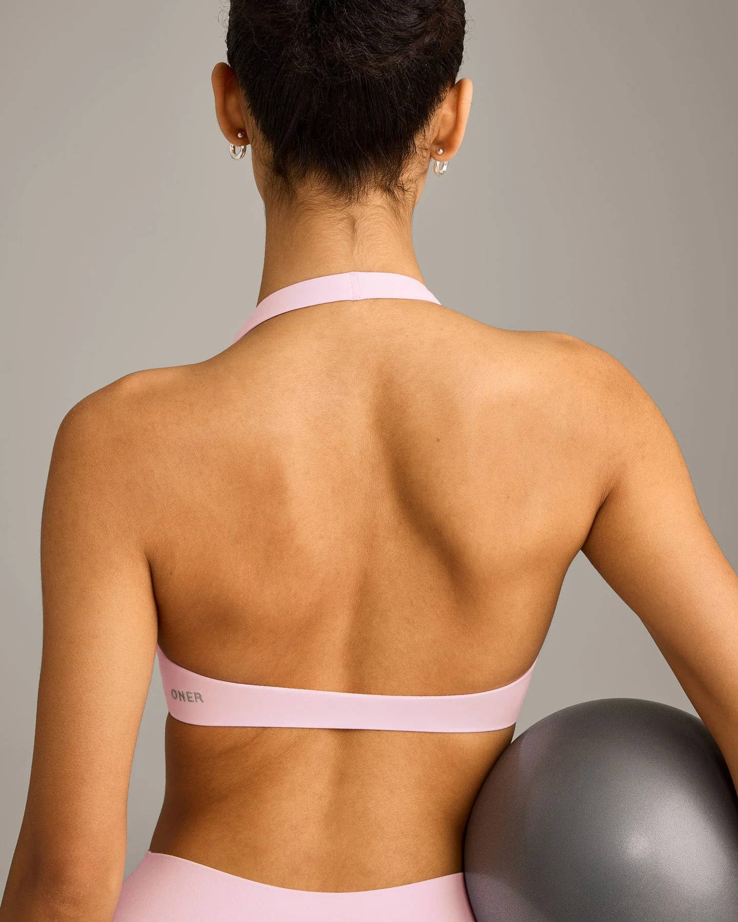 SoftMotion™ Minimal Halter Neck Bralette with Grey Logo | Soft Girl Pink - Image 6