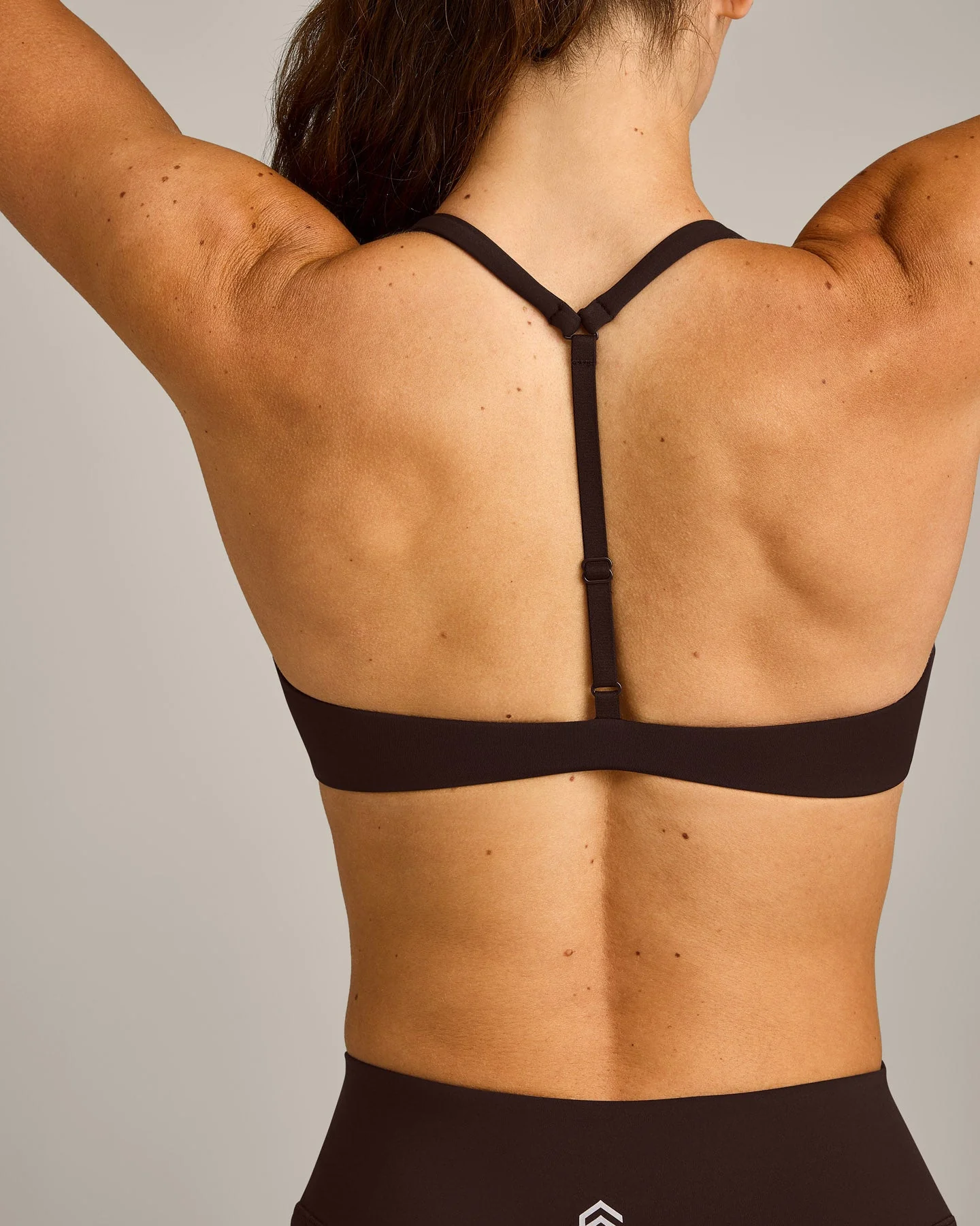UnifiedMove™ T Back Minimal Bralette with Reflective Logo | 70% Cocoa - Image 4