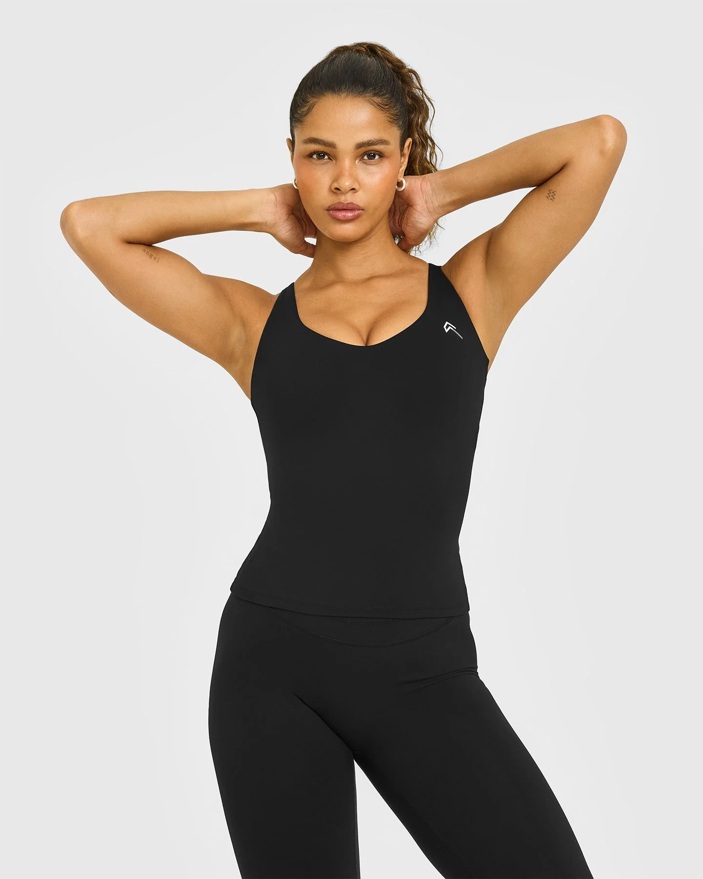 UnifiedMove™ V Neck Cross Back Vest White Logo | Black